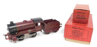 A Hornby O gauge tinplate clockwork No 501 locomotive (reversing), and tender, 0-4-0, LMS red livery, in original boxes.