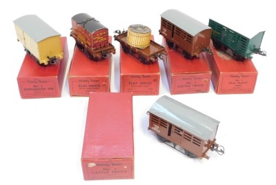 Hornby O gauge boxed rolling stock, comprising LMS flat truck with cable drum, LMS flat truck with container, No 1 cattle truck (x2), No 1 van, and No 1 refrigerator van. (6)