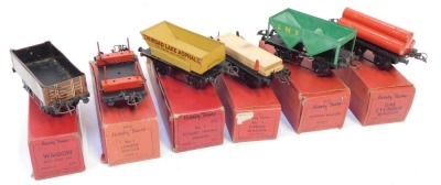 Hornby O gauge tinplate rolling stock, comprising gas cylinder wagon, No 1 timber wagon, wagon with sheet rail, hopper wagon, No 1 rotary tipping wagon, and No 1 lumber wagon. (6)