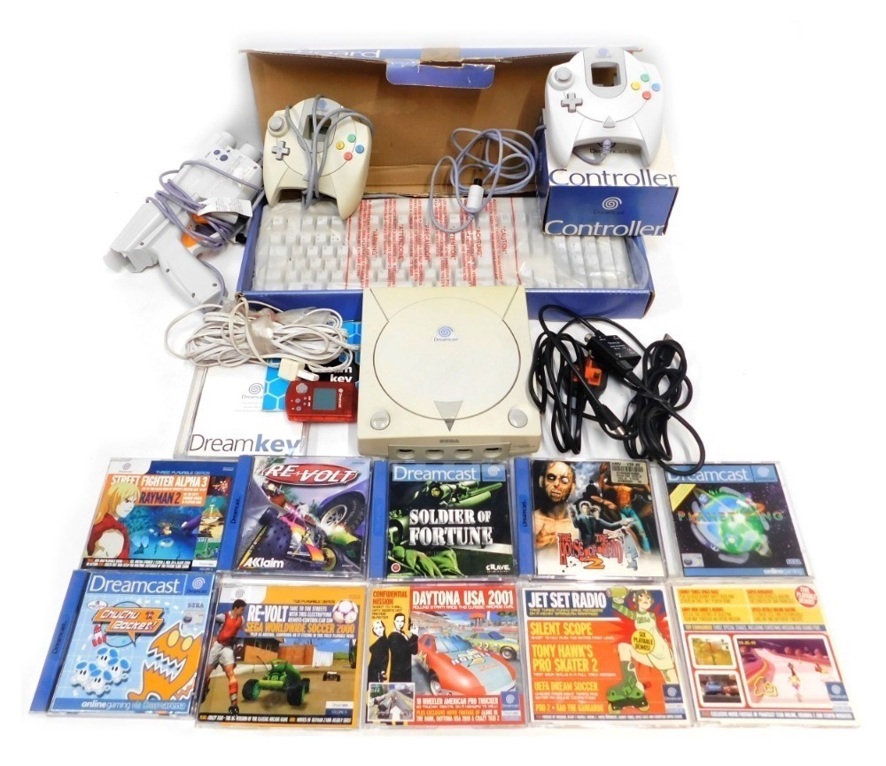 A Sega Dreamcast, with controllers, keyboard, and games, including House of  the Dead 2, ChuChu Rocket,