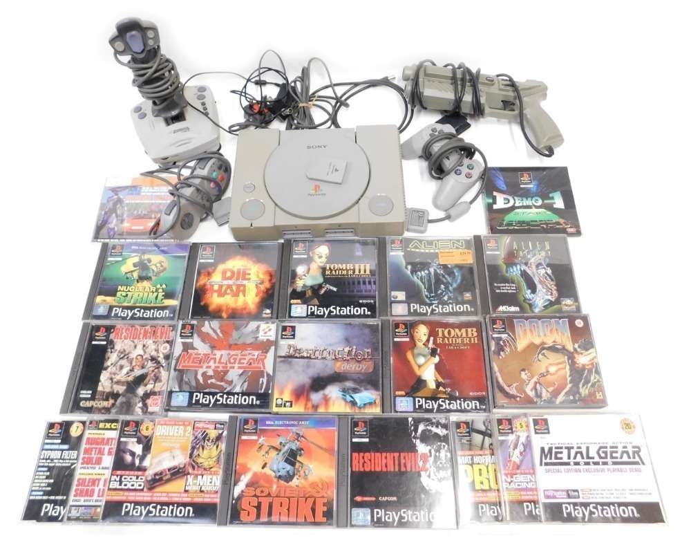 A Sony Playstation, with controllers, accessories and games, including Alien  Trilogy, Alien Resurrection, Resident Evil, Die