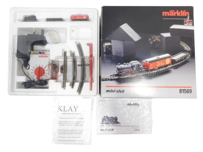 A Marklin Mini Club Z gauge freight starter set, including oval track switched mode power pack and locomotive controller, DB class 89 steam locomotive, DB low side car and a wall refrigerator car, boxed.