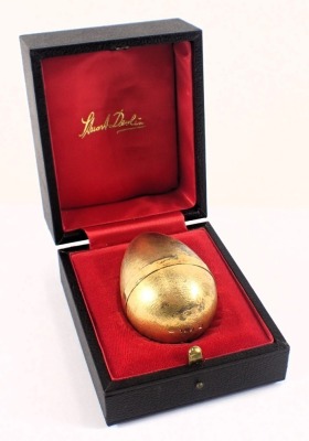 A Stuart Devlin silver parcel gilt Mad March Hare egg, the brushed egg opening to reveal a silvered hare, numbered 159 to underside, London 1973, with unmarked silver gilt coloured stand, 6.40oz, 7cm high, boxed with certificate, limited edition number 20 - 5