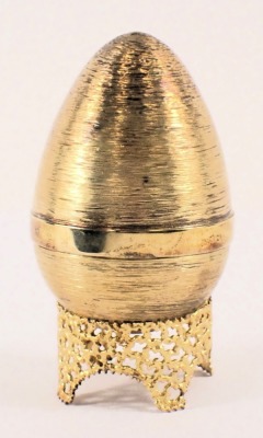 A Stuart Devlin silver parcel gilt Fledgling egg, London 1971, with unmarked silver gilt coloured stand, 6.40oz, 7cm high, boxed with certificate. - 2