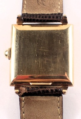 A late 1940s Rolex gent's wristwatch, with square watch head and a white interface with seconds dial and gold hands, numbered 498641, 4330, yellow metal stamped 14k 585, on a later brown leather strap, the dial 2.5cm diameter, with a seventeen rubis movem - 3