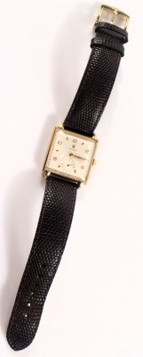 A late 1940s Rolex gent's wristwatch, with square watch head and a white interface with seconds dial and gold hands, numbered 498641, 4330, yellow metal stamped 14k 585, on a later brown leather strap, the dial 2.5cm diameter, with a seventeen rubis movem - 5