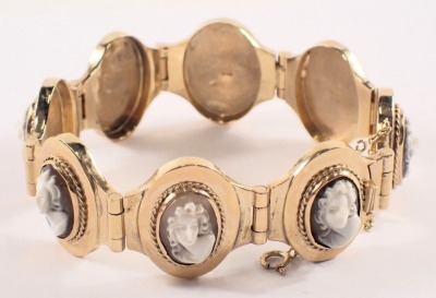 A cameo bracelet, with eight oval panels, each with raised cameo depicting female figure, in a rubbed yellow metal bracelet frame, with safety chain and clasp, stamped 375, 20cm long, 37.8g all in, boxed. - 4