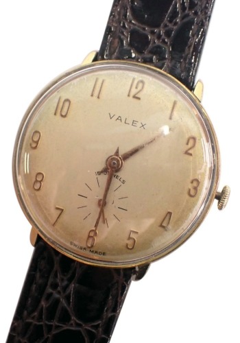 A Valex gent's dress wristwatch, with a silvered coloured dial and gold numeric border and seconds dial, with fifteen jewel movement, stainless steel back and gold plated outer border, on a later brown leather strap, the dial 2.5cm diameter.