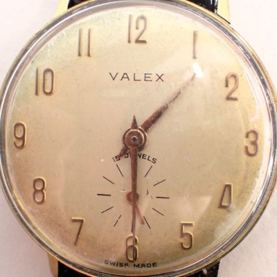 A Valex gent's dress wristwatch, with a silvered coloured dial and gold numeric border and seconds dial, with fifteen jewel movement, stainless steel back and gold plated outer border, on a later brown leather strap, the dial 2.5cm diameter. - 2