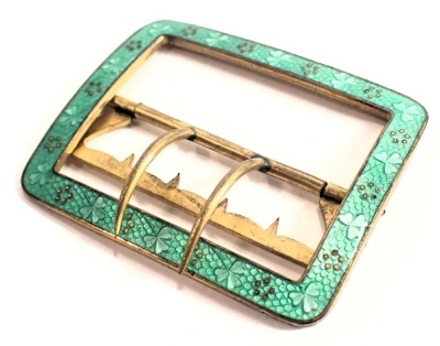 An enamel belt buckle, of rectangular design, with green enamel clover border, with brass backing, 5cm x 6cm.