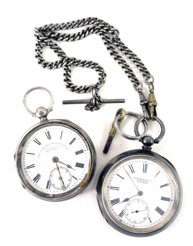 A silver cased pocket watch with white enamel dial, stamped The Express English Lever retailed by JG Greaves of Sheffield, Chester hallmarks, and a white metal pocket watch, retailed by Langdon Davis and Co Birmingham, Swiss made movement and case. (2)