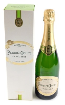 A bottle of Perrier-Jouet Grand Brut Champagne, boxed.