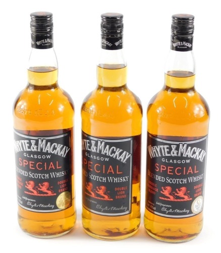 Three bottles of Whyte and Mackay Glasgow special blended scotch whisky, 1ltr.