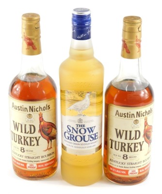 Two bottles of Austin Nichols Wild Turkey old number eight brand Kentucky straight bourbon, and a bottle of The Snow Grouse blended grain scotch whisky. (3)