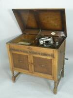 A Gilbert model 73 gramophone in oak cabinet