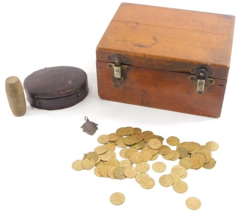 A quantity of gilt tokens, to include some stamped Joannes Ille Coquus, others with Indian or Arabic script, some drilled, in oval leather box, etc.