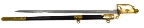 A reproduction Naval dress sword, marked by Richard Teed of The Strand, plain blade, brass guard, and ivory handle and a part leather scabbard, 100cm long overall.