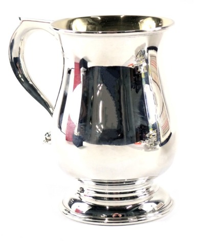 A Queen Elizabeth II silver tankard, with moulded thumb piece and gilded interior, maker JR, Birmingham 1973, 9.21oz, 13cm high.