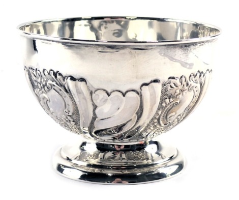 An Edward VII silver sugar bowl, with embossed scroll and swag design, on stepped foot, Birmingham 1906, 2.60oz, 7cm high.