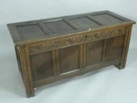 An early 18thC carved and panelled oak coffer