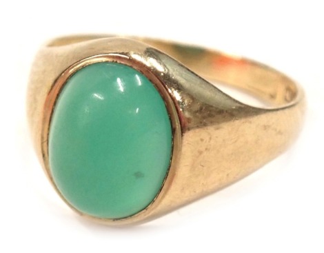 A 9ct gold signet ring, with a polished cabachon pale green stone, ring size L, 2.6g all in.