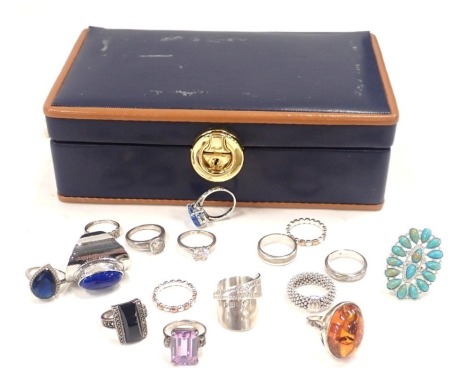 A group of assorted silver and other dress rings, comprising an imitation amber set dress ring, bicolour wedding bands stamped 925, lapis lazuli set dress ring, etc. enclosed in a jewellery box.