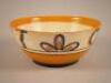 A Clarice Cliff Bizarre bowl decorated with stylised leaves and geometric devices