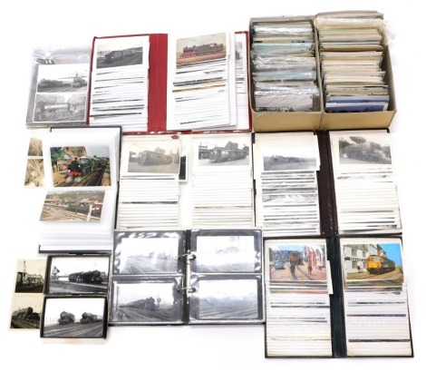 A group of steam railway related postcards, to include black and white photographic postcards, coloured postcards, steam day rallies, slides, etc. (1 box)