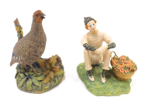 A Border Fine Arts figure of a partridge, modelled by Ayres, bears label, 18cm high, and a further Border Fine Arts figure of a Pierrot, modelled seated beside a basket of flowers, modelled in black, limited edition 1343/2500, bears label, 13cm high. (2)