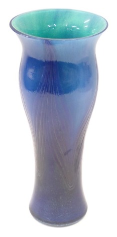 A blue Art Glass vase, with a flared rim and swirl design body, 26cm high.