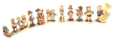 A group of Goebel Hummel figures, to include musicians, children playing, etc. (12)