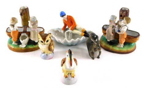 Decorative china, comprising Royal Crown Derby owl pepper pot, Royal Crown Derby pelican salt pot, 7cm and 9cm high, a pair of Continental porcelain figure groups of children by water bath, a Danish Squirrel, and a huntsman. (6)