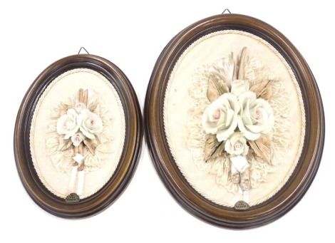 Two Via Veneto ceramic flower pictures, each of oval design with material back, on oak frame, 26cm and 18cm high. (2)