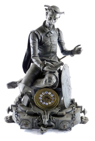 A late 19thC French spelter figural mantel clock, modelled in the form of a gentleman reading a book seated on the clock face, on an ornate base with chains and paw feet, 60cm high. (AF)