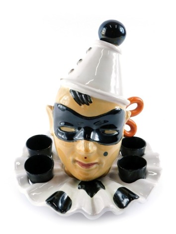 A Pucci pottery liqueur set, modelled in the form of a clown or pierrot, numbered 1575, 23cm high. (AF)