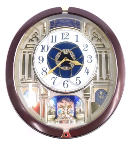 A Seiko Melodies in Motion battery operated musical clock, 43cm x 40cm.