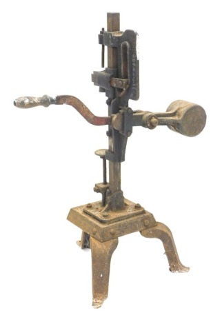 A cast iron instrument stamped Barnett and Foster London, possibly part of the mineral water bottling process, 113cm high.