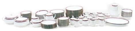 A Noritake Legendary part dinner and tea service, each piece decorated with a red marbled band within gilt borders.