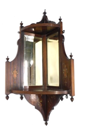 A late 19thC rosewood and marquetry corner unit, with mirrored back, decorated with urns, 89cm high, 42cm wide.