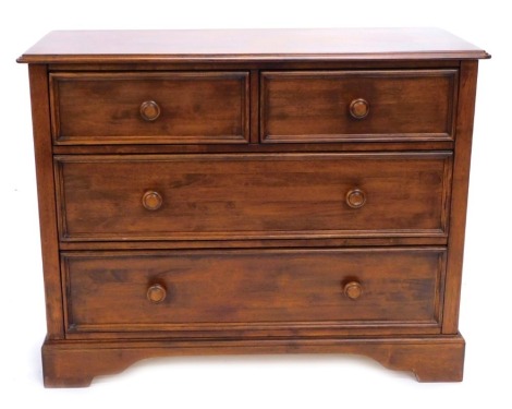 A continental cherrywood chest of drawers, the top with a moulded edge with two short and three long drawers each with turned wood handles on bracket feet, 110cm wide.