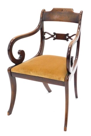 A Regency mahogany open armchair, with bar back, drop in seat, on sabre legs.