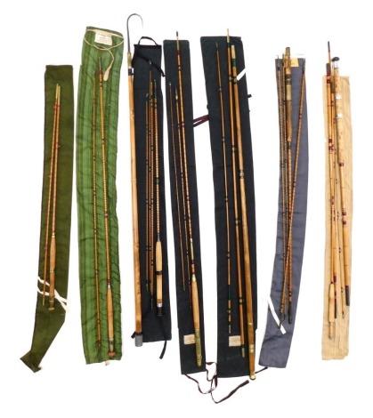 A collection of fully renovated split cane fishing rods, two stamped Carters and Army and Navy, a Course fishing rod, and a wooden three piece rod, possibly green heart.