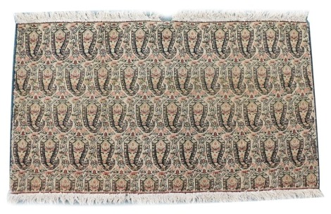 A Kurdish Senneh rug fragment, decorated with four rows of boteh, 52cm x 94cm, sold with a copy of an accompanying letter from a rug specialist, Waldemar Von Elsner of Hamburg 1975.