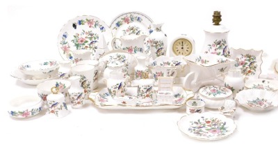 A group of Aynsley Pembroke pattern porcelain tablewares and ornaments, including vases, dishes, mantel clock, table lamp, wheelbarrow, scent bottle and miniature furniture. (a quantity) Buyer Note: WARNING! This lot contains untested or unsafe electrica