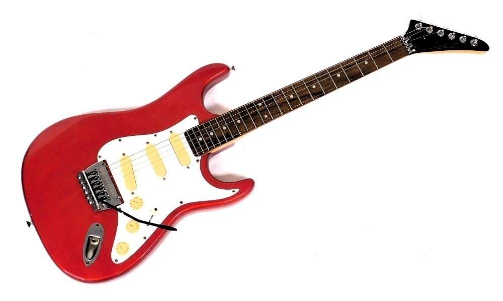 An Encore Coaster six string electric guitar in red and white