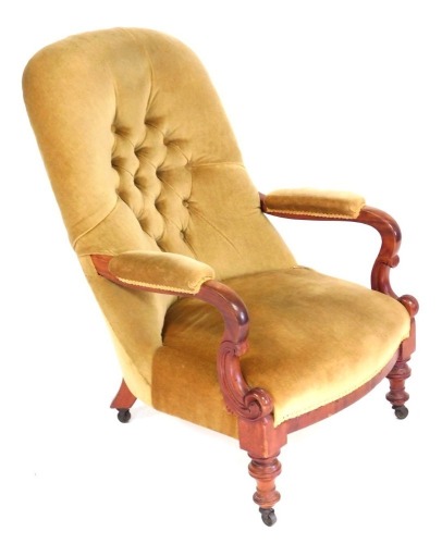 A Victorian mahogany button back nursing chair, upholstered in gold draylon, raised on turned legs, on castors, 63cm die.