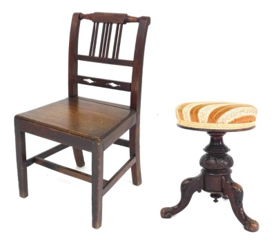 A Victorian mahogany revolving piano stool, with overstuffed upholstered seat, above a lappet and foliate carved column over three leaf carved cabriole legs, 52cm high, together with a Georgian country dining chair. (2)