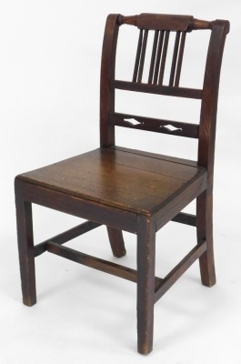 A Victorian mahogany revolving piano stool, with overstuffed upholstered seat, above a lappet and foliate carved column over three leaf carved cabriole legs, 52cm high, together with a Georgian country dining chair. (2) - 3