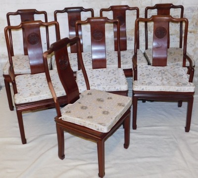 A Chinese hardwood oval dining table, with two additional leaves, raised on square legs and spade feet, 77cm high, 152cm wide, 244cm extended, 112cm deep, together with eight dining chairs, with loose cushion seats, comprising a pair of carvers and six si - 4