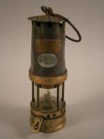 A miners lamp manufactured by Naylor of Wigan